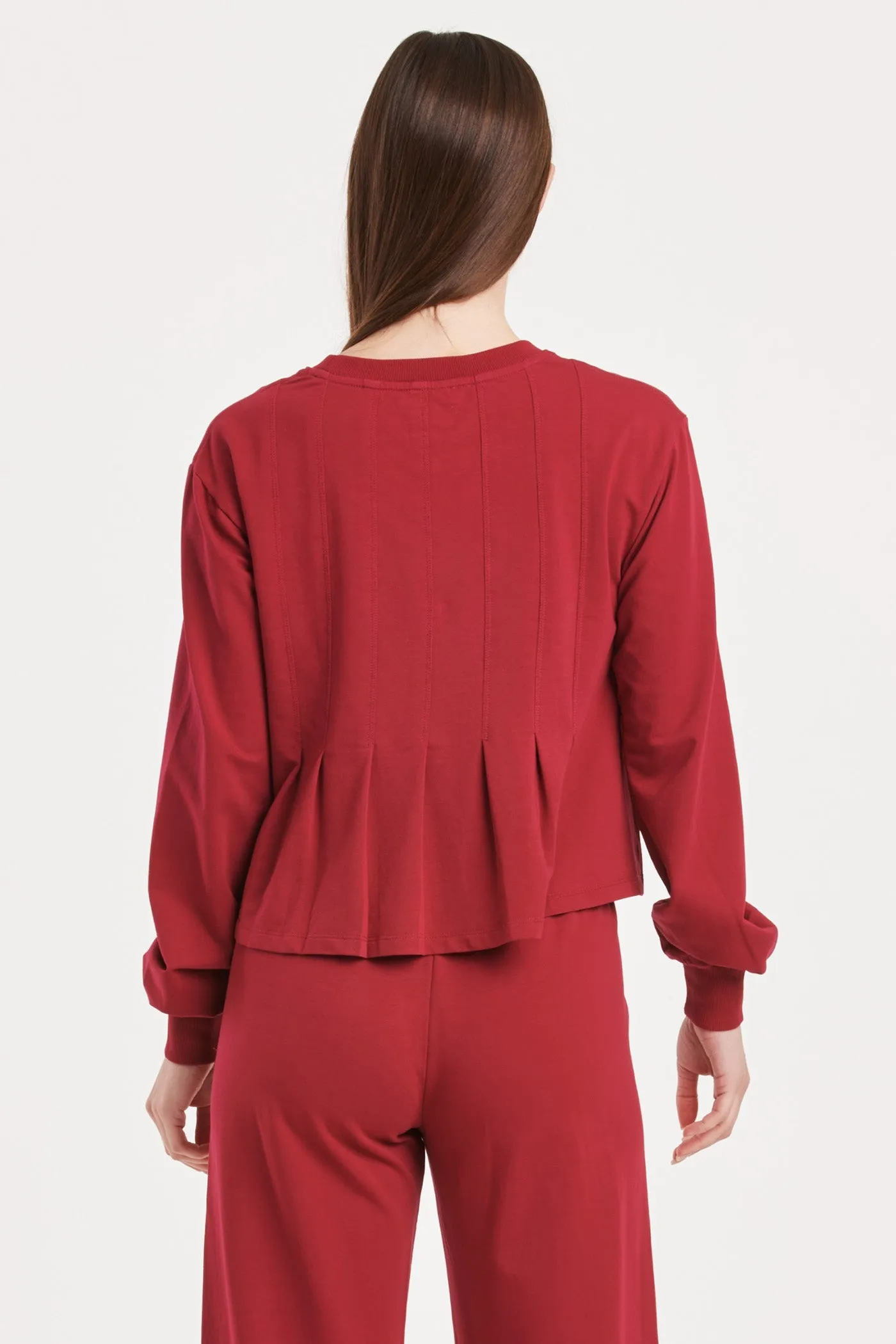 DOVE LONG SLEEVE PLEATED PEPLUM TOP GRANADA