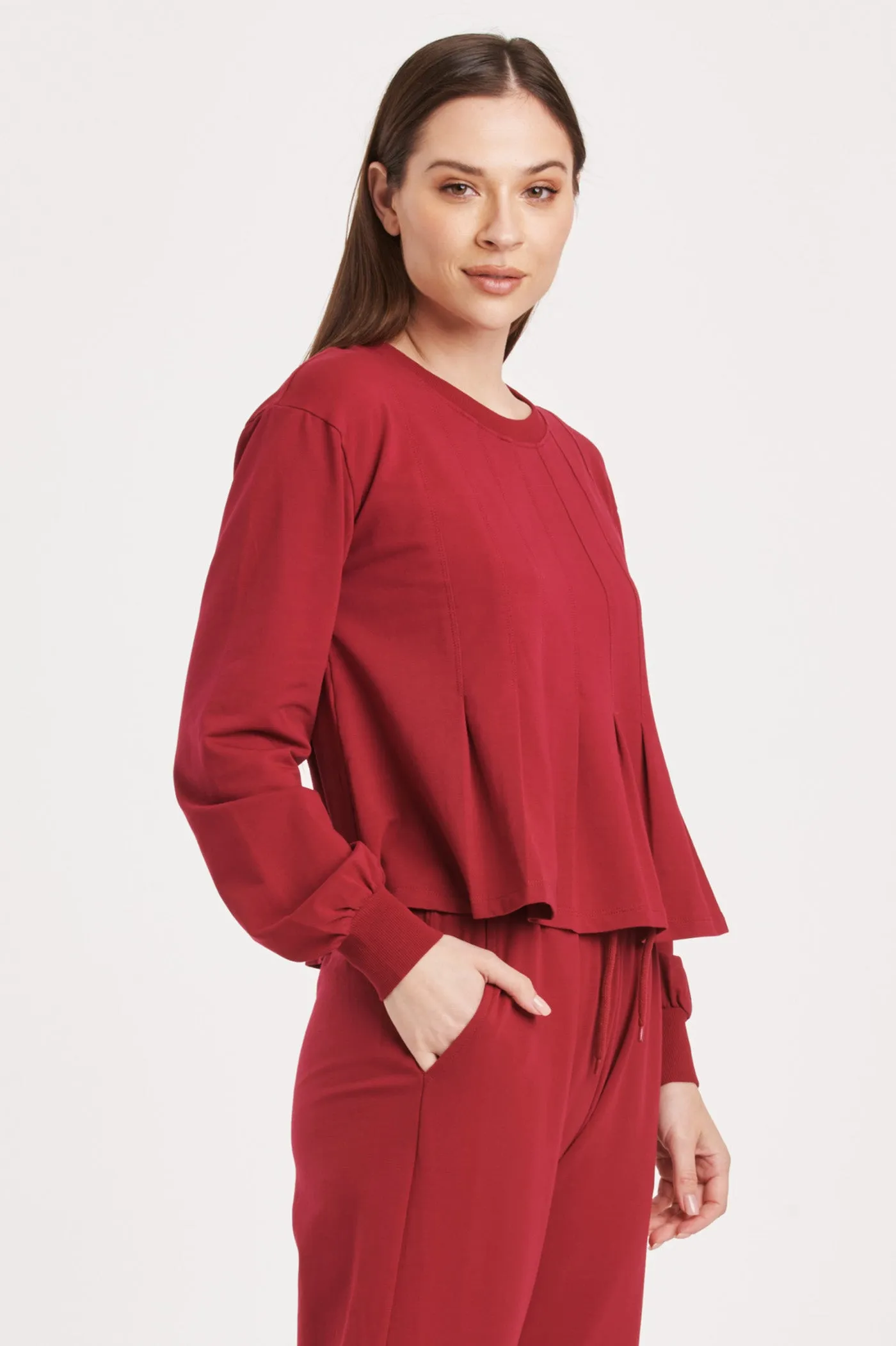 DOVE LONG SLEEVE PLEATED PEPLUM TOP GRANADA